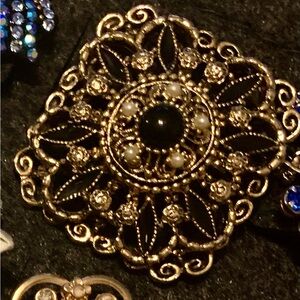 Elegant Black and Gold filigree Brooch